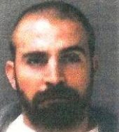 Courtney’s booking photo in 2004, after being misidentified by the victim, and charged with rape.